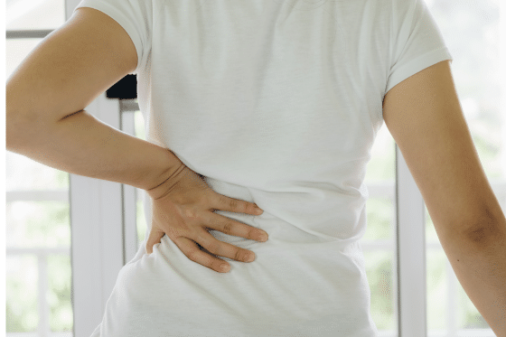 A woman suffers from low back pain